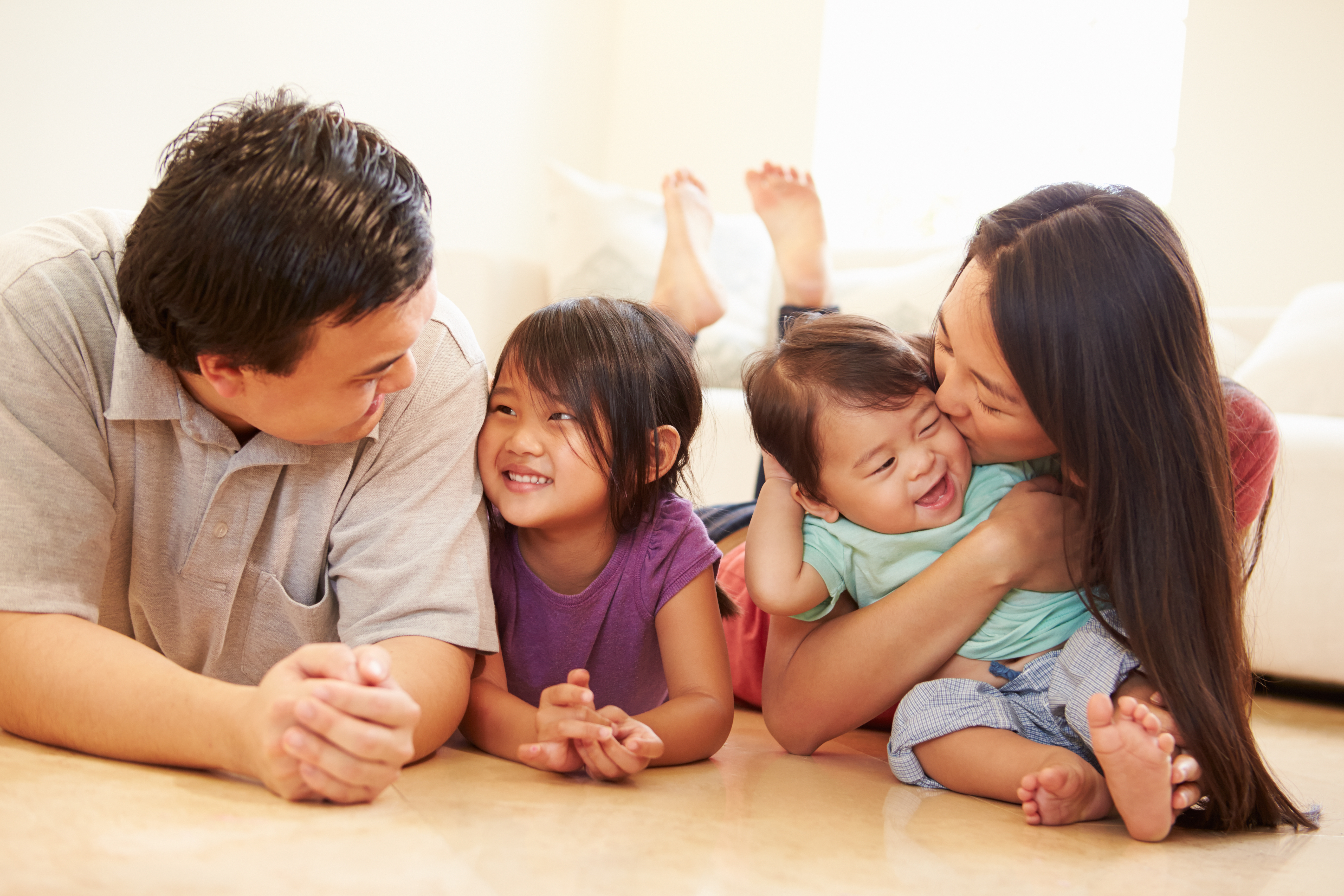 family happy on clean tile and hardwood floor family on clean tile and hardwaood floor
